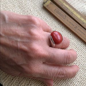 Silver ring with red stone insert